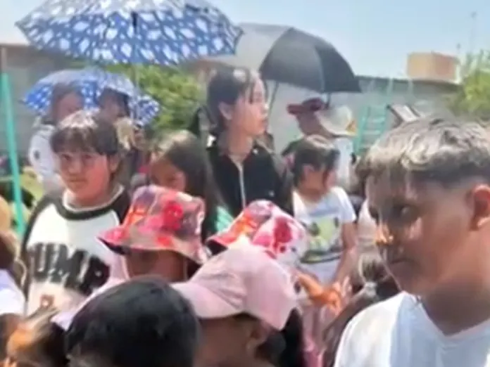Children receiving gifts at a Children's Day event