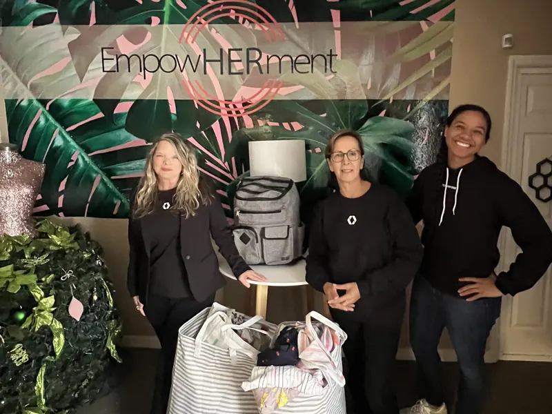 The team with donations at the EmpowHERment event