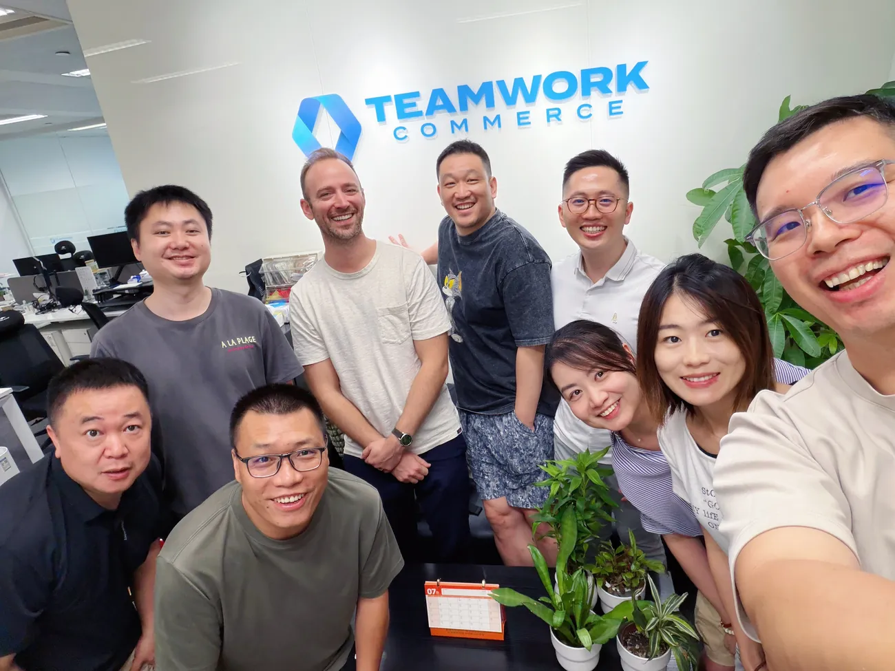 The Asia office team at the Teamwork Commerce wall